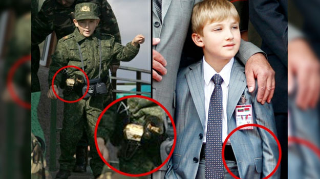Сын  Президента Белоруссии прячет под пиджаком золотой пистолет?